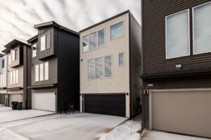 Exterior front of brand new 3-storey home in River’s Edge Edmonton