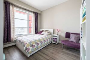 Bedroom with approved laminate flooring at The Ion Ambleside
